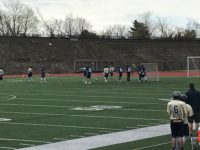 The two teams in the midst of a game.