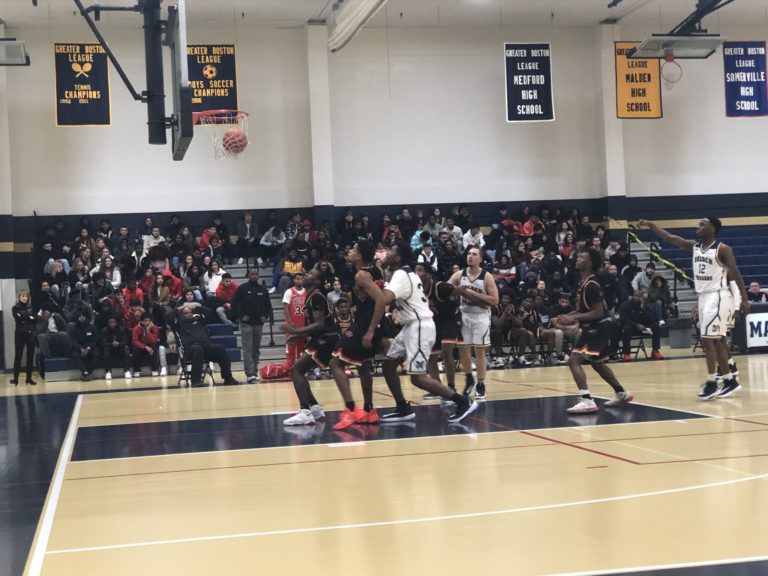 Number 12 scoring another three-pointer. Photo take by Desiree Nong.
