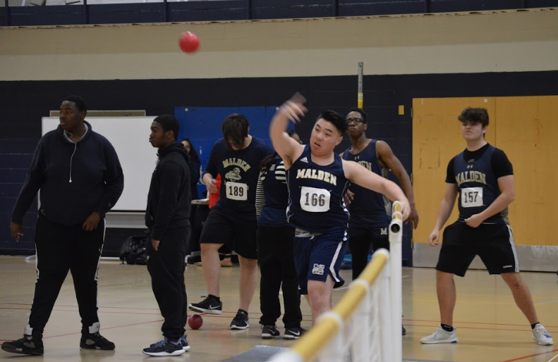 Junior Damien Huynh Throwing the shot. Photo by David Cartledge