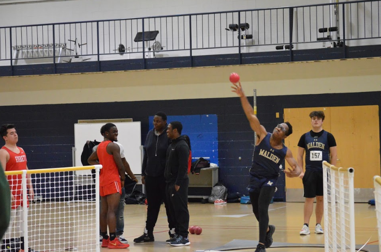 Senior Jean Gerard Throwing The Shot. Photo by David Cartledge