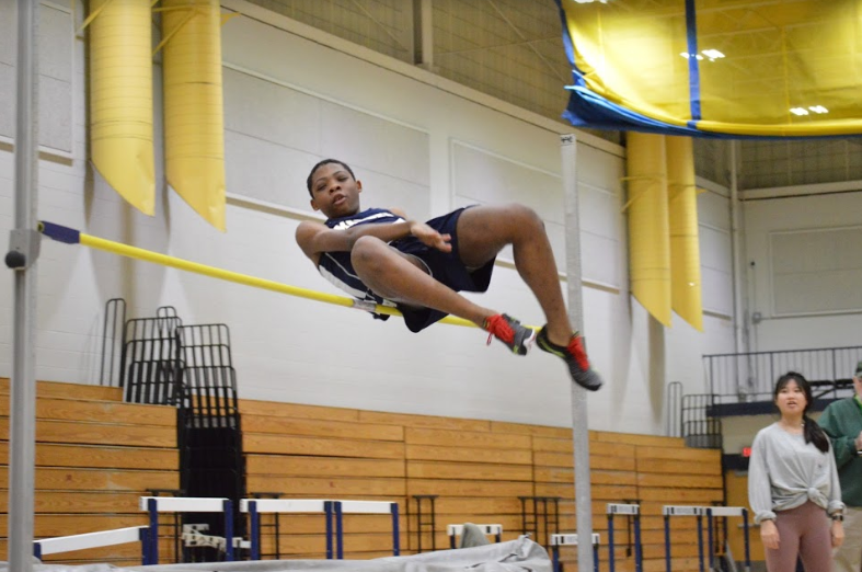 Sophomore Jelani Garrett competing in the high jump. Photo by David Cartledge