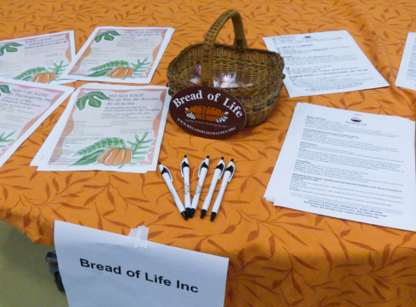 Papers fill the Bread of Life stand. Photo by Jessica Li.