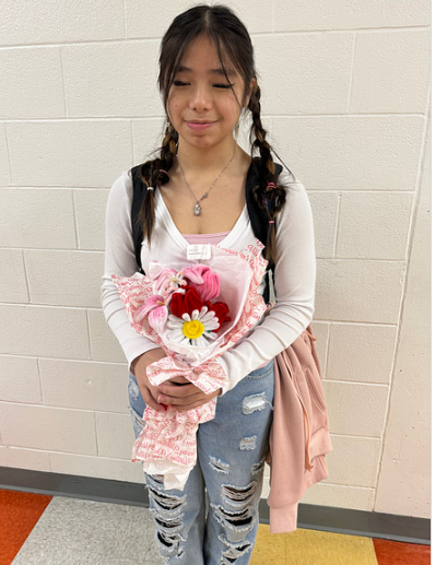 Students who purchased the pipe cleaners flowers after they were distributed. Photos submitted by Gabriela Parini Cordova