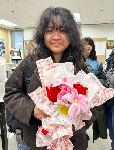 Students who purchased the pipe cleaners flowers after they were distributed. Photos submitted by Gabriela Parini Cordova